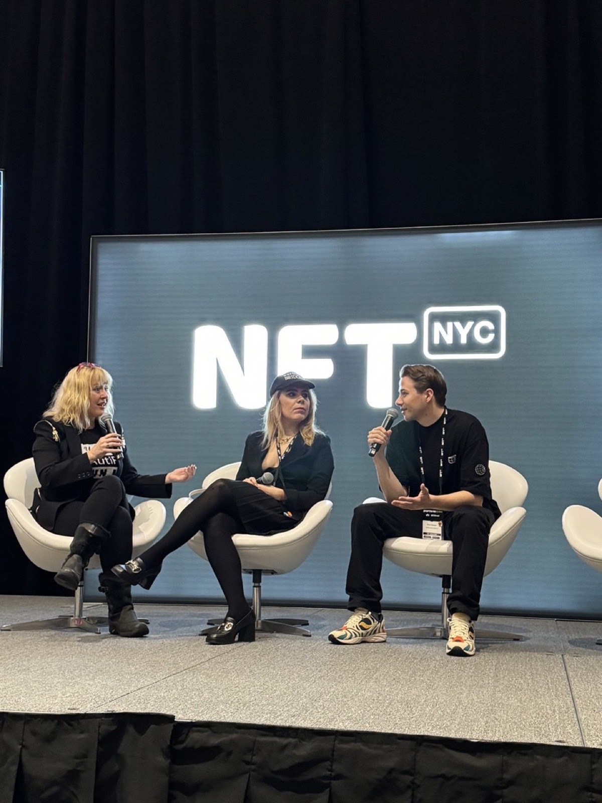 Kacper speaking on stage at NFT.NYC