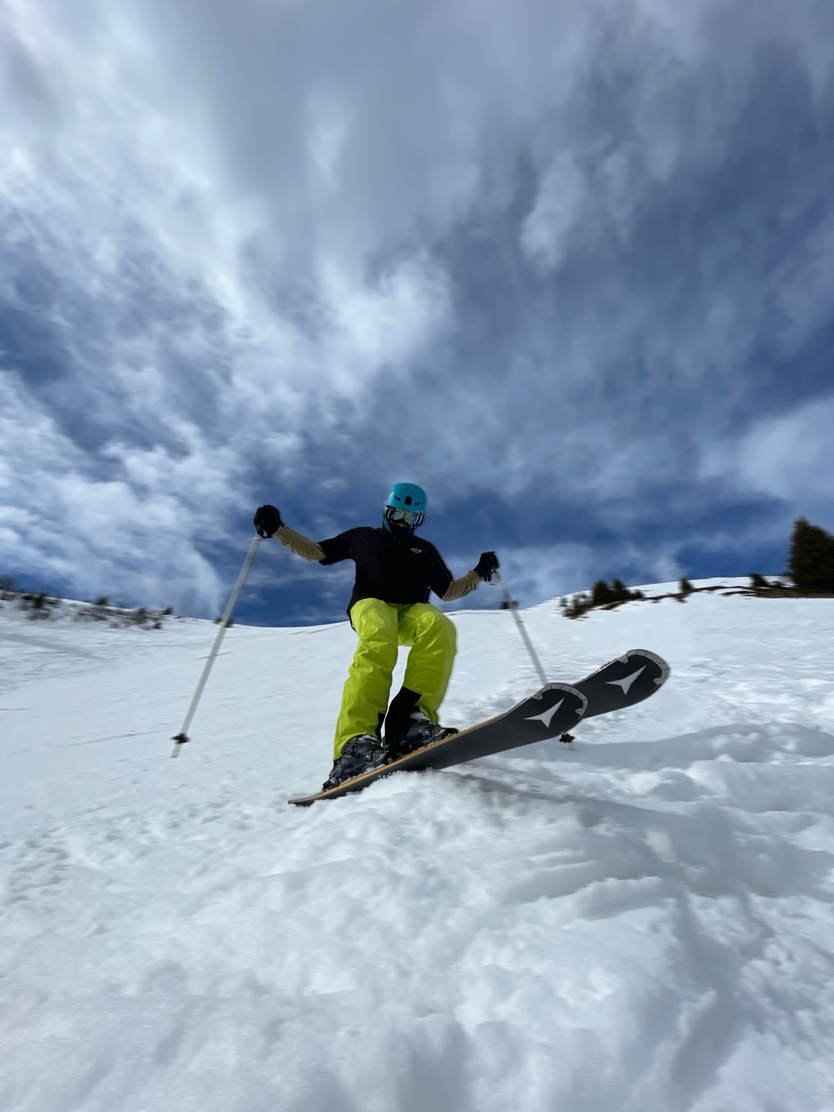 Kacper skiing under a cloudy sky